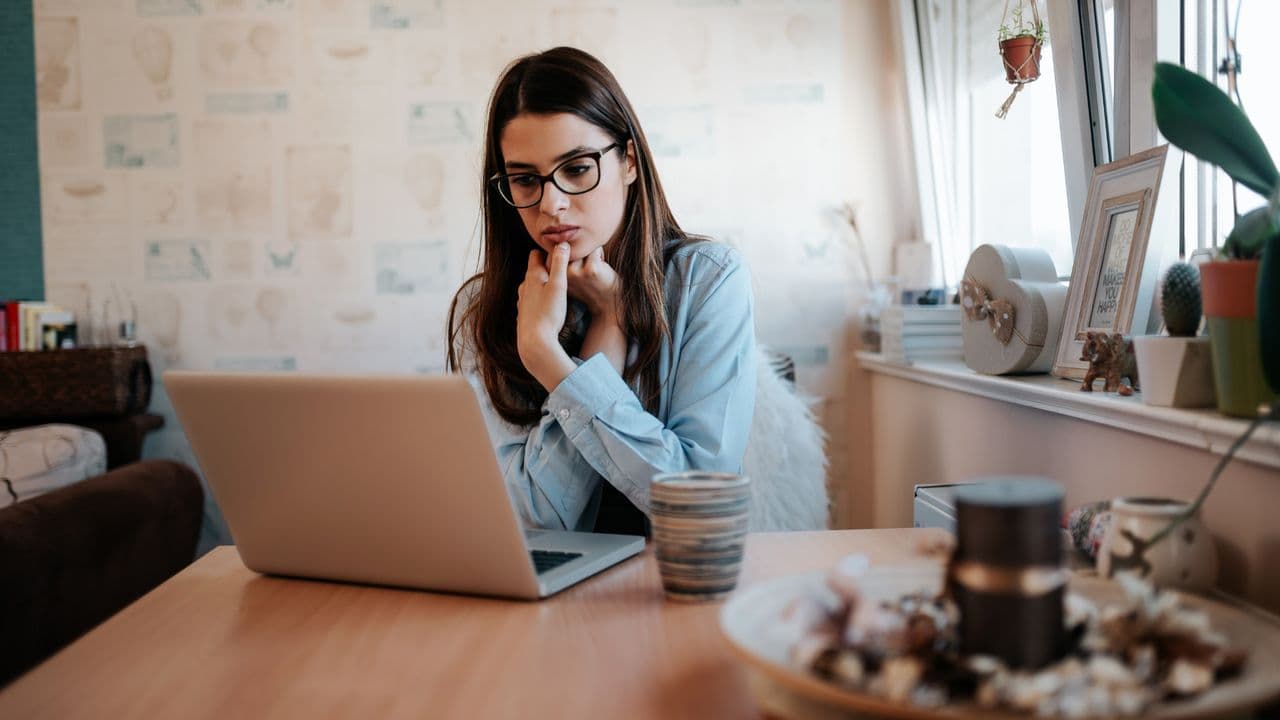 Candidate preparing for an interview at a laptop